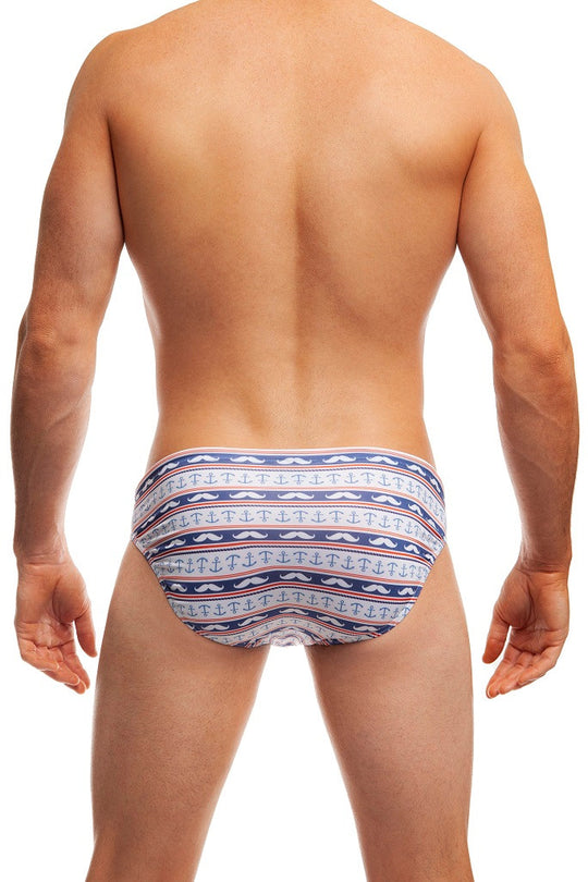 Man standing wearing a pair of Jack Adams blue/white Stash and Anchor Swim Brief (back view) on a white background.