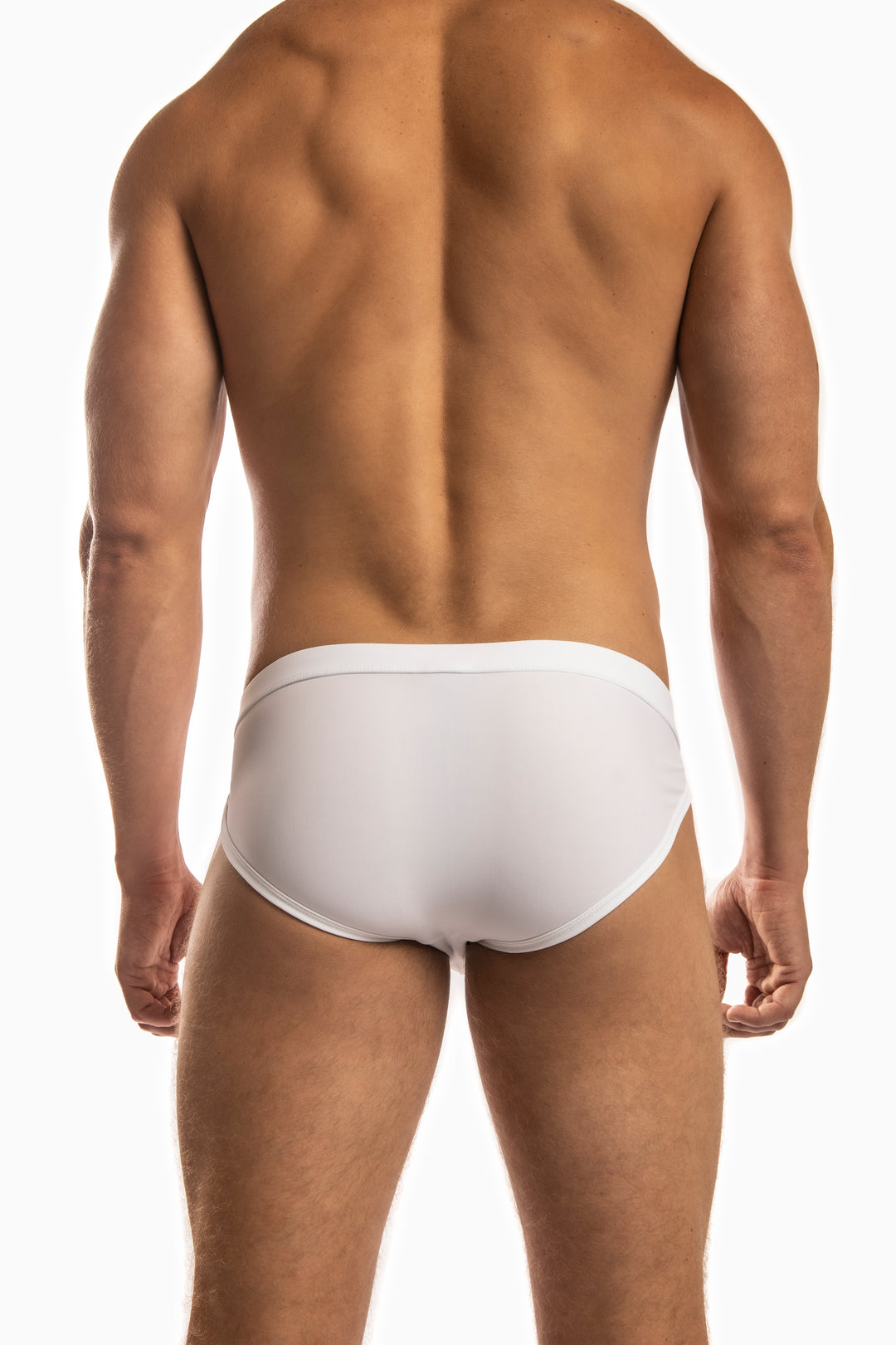 Man wearing a pair of Jack Adams white Apollo Swim Briefs (back view) standing before a white background.