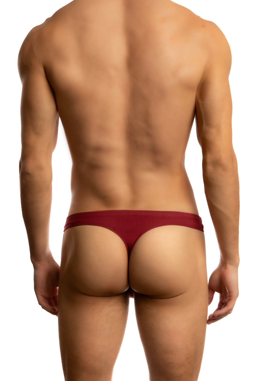 Man wearing a Jack Adams tibetan red thong (back view) on a white background