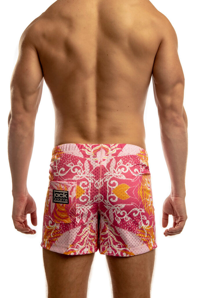 Man standing wearing a pair of Jack Adams tropic pink Freestyle Mesh Shorts (back view) on a white 
