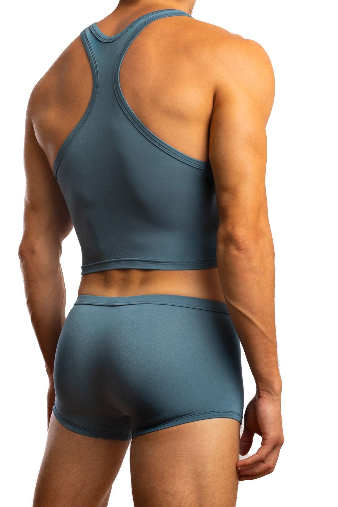 Shirtless man standing in front of a white background wearing a pair of Jack Adams In Intimo Cropped Modal Tank in blue silver (back view)