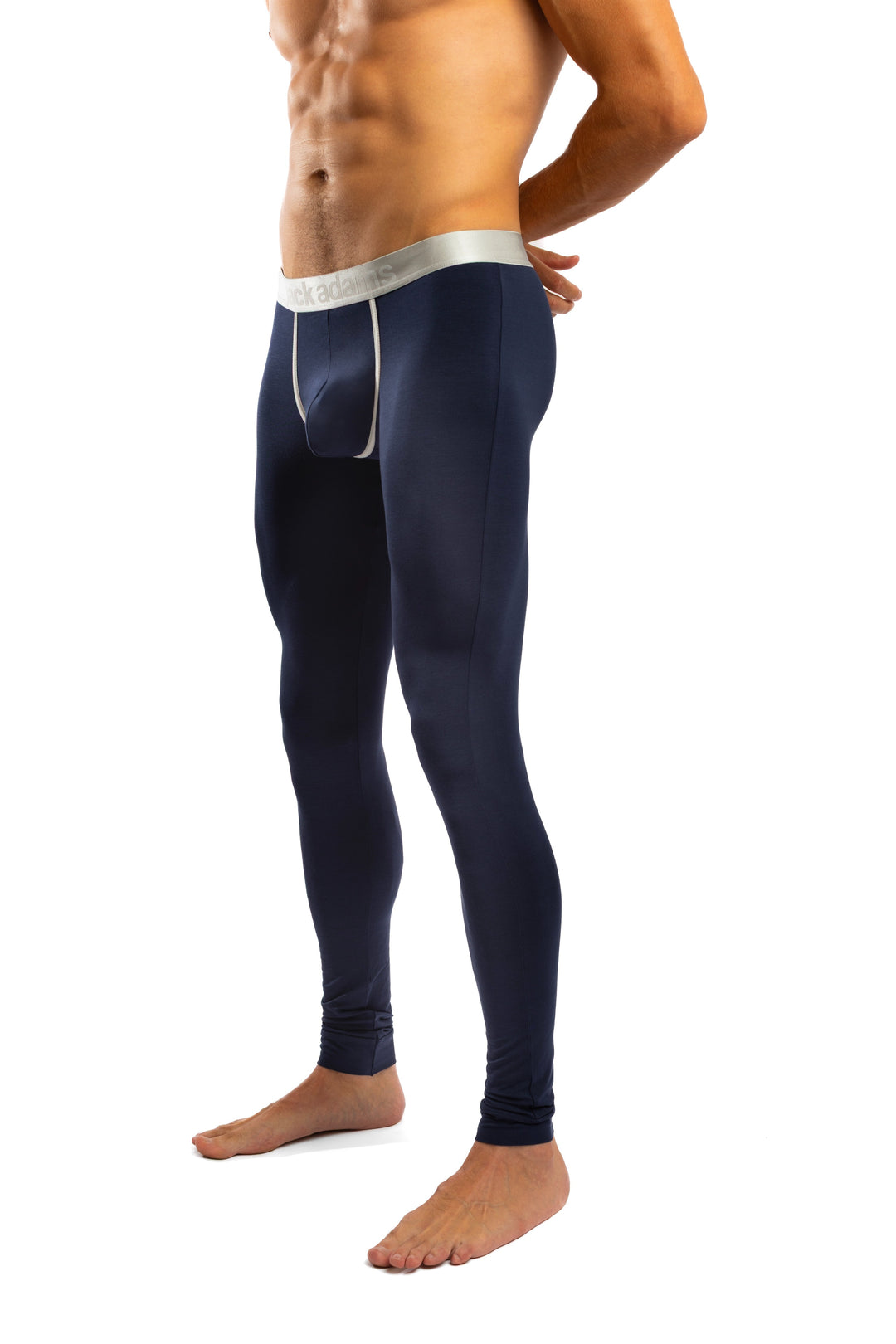 Shirtless man standing in front of a white background wearing a pair of Jack Adams 2Stripe Luxe Long John in midnight blue (profile view)