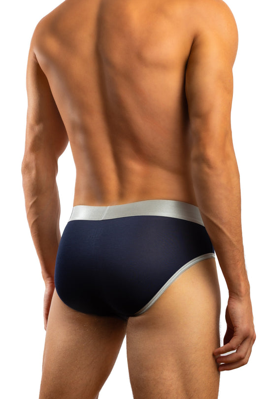 Shirtless man standing in front of a white background wearing a pair of Jack Adams 2Stripe Luxe Brief in midnight navy (back view)